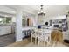 Open-concept dining area offering views into the kitchen and living room at 1705 Lewis St, Lakewood, CO 80215