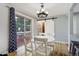 Bright dining area with sliding glass doors and a sliding barn door at 1705 Lewis St, Lakewood, CO 80215
