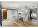 Open-concept dining area leading into the kitchen with a breakfast bar at 1705 Lewis St, Lakewood, CO 80215