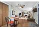 Dining room with a table and chairs, next to an open living space at 1705 Lewis St, Lakewood, CO 80215