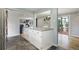 Spacious kitchen island connecting living spaces, offering a functional layout at 1705 Lewis St, Lakewood, CO 80215