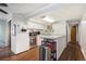 A well-lit kitchen featuring stainless steel appliances and ample countertop space at 1705 Lewis St, Lakewood, CO 80215