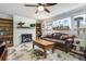 Inviting living room with a brick fireplace, large window, and comfortable leather sofa at 1705 Lewis St, Lakewood, CO 80215