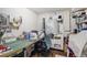 Home office featuring a sewing station, pegboard, and shelving units at 1705 Lewis St, Lakewood, CO 80215