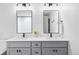 Modern bathroom vanity featuring double sinks, sleek lighting, and subway tile at 108 Arapahoe St, Golden, CO 80403