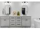 Stylish bathroom vanity featuring double sinks, modern lighting, and sleek white subway tile at 108 Arapahoe St, Golden, CO 80403