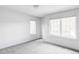 Bright bedroom with neutral carpet, white trim, and natural light at 108 Arapahoe St, Golden, CO 80403