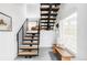 Bright entryway with modern staircase, wooden bench, and tiled floor at 108 Arapahoe St, Golden, CO 80403
