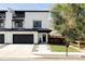 Contemporary white farmhouse with black trim, garage, and a well-manicured front yard at 108 Arapahoe St, Golden, CO 80403