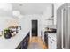 Bright kitchen featuring stainless steel appliances, long countertops, and a blue kitchen island at 108 Arapahoe St, Golden, CO 80403