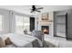 Spacious main bedroom boasts natural light, a ceiling fan, and a fireplace at 108 Arapahoe St, Golden, CO 80403