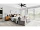 A bright main bedroom features sitting area, ceiling fan, and a sliding door that provides backyard views at 108 Arapahoe St, Golden, CO 80403