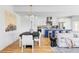 Open-concept layout showcasing dining, kitchen with blue island, and cozy living spaces at 108 Arapahoe St, Golden, CO 80403