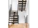 Modern staircase features wood treads and black metal railings with abundant natural light at 108 Arapahoe St, Golden, CO 80403