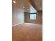 Spacious carpeted basement with natural light from a window and recessed lighting at 10031 Truckee St, Commerce City, CO 80022