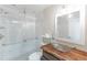 Modern bathroom with glass shower, stylish vanity, and white subway tile at 10031 Truckee St, Commerce City, CO 80022