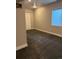Cozy bedroom featuring neutral carpet, a white door, and a bright window at 10031 Truckee St, Commerce City, CO 80022