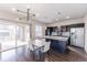 A stylish eat-in kitchen featuring a center island, stainless steel appliances, and sliding glass doors to the patio at 10031 Truckee St, Commerce City, CO 80022