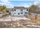 Beautiful backyard showcasing the two-story home, patio area, and surrounding landscape at 18715 Wagon Trl, Mead, CO 80542