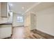 Basement area with wood-look flooring, plenty of room, and white cabinetry by the window at 18715 Wagon Trl, Mead, CO 80542