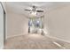 Bright bedroom featuring natural light and cozy carpeting with a ceiling fan at 18715 Wagon Trl, Mead, CO 80542