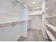 Spacious walk-in closet with custom shelving and ample storage space at 18715 Wagon Trl, Mead, CO 80542