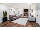 Inviting living room featuring a decorative fireplace, stylish decor and a plush seating arrangement at 18715 Wagon Trl, Mead, CO 80542