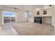 Spacious living room features a fireplace, large windows, and sliding door to the backyard at 18715 Wagon Trl, Mead, CO 80542