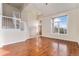 Spacious living room with hardwood flooring and a staircase leading to the second floor at 18715 Wagon Trl, Mead, CO 80542
