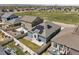 Aerial view of property showcasing a fully fenced yard, solar panels, and great neighborhood at 6912 Poudre St, Frederick, CO 80530