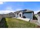 Spacious backyard featuring a well-maintained lawn, patio, and low-maintenance landscaping at 6912 Poudre St, Frederick, CO 80530