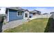 Beautifully landscaped backyard with a patio, green lawn, and privacy fence at 6912 Poudre St, Frederick, CO 80530