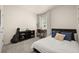 Comfortable bedroom featuring a full-sized bed, desk, and storage unit at 6912 Poudre St, Frederick, CO 80530