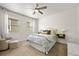 Cozy bedroom featuring soft natural light, ceiling fan and comfortable furnishings at 6912 Poudre St, Frederick, CO 80530