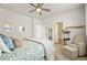 Bright bedroom with stylish furnishings, including a comfortable chair and decorative accents at 6912 Poudre St, Frederick, CO 80530