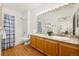 Bright bathroom with double sinks, granite countertop, and a shower-tub combination at 6013 Castlegate W Dr # D14, Castle Rock, CO 80108