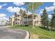 Inviting multi-story condo with a private porch, landscaped lawn and sidewalks at 6013 Castlegate W Dr # D14, Castle Rock, CO 80108