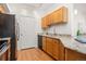 Traditional kitchen features granite countertops, stainless steel appliances, and wood floors at 6013 Castlegate W Dr # D14, Castle Rock, CO 80108