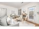 Comfortable living room with modern decor, fireplace, hardwood floors, and ample natural light at 6013 Castlegate W Dr # D14, Castle Rock, CO 80108