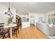 Open-concept living and dining area with hardwood floors and lots of natural light at 6013 Castlegate W Dr # D14, Castle Rock, CO 80108