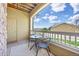 Cozy patio with seating, a small table, and a pleasant neighborhood view at 6013 Castlegate W Dr # D14, Castle Rock, CO 80108