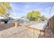 Community bocce ball court surrounded by trees, mulch and string lighting at 6495 E Happy Canyon Rd # 22, Denver, CO 80237