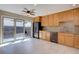 Bright kitchen featuring sliding glass doors to the patio, stainless steel appliances and tile flooring at 6495 E Happy Canyon Rd # 22, Denver, CO 80237
