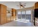 Bright kitchen featuring modern cabinets, tile flooring, stainless steel appliances, and large sliding glass doors to the patio at 6495 E Happy Canyon Rd # 22, Denver, CO 80237