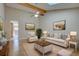 Bright living room featuring high ceilings, skylights, neutral tones, ceiling fan and comfortable seating arrangement at 6495 E Happy Canyon Rd # 22, Denver, CO 80237