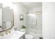 Stylish bathroom featuring marble tiling, brass hardware, and modern fixtures at 863 S Dudley St, Lakewood, CO 80226