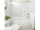 Bathroom with marble tiling and brass hardware at 863 S Dudley St, Lakewood, CO 80226