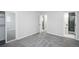 Bedroom with closet, ensuite bathroom, and carpeted floors at 863 S Dudley St, Lakewood, CO 80226