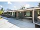 Charming home with mature trees, a covered porch, and professionally landscaped yard at 863 S Dudley St, Lakewood, CO 80226