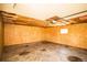 Unfinished garage with visible wooden framing and concrete floor at 863 S Dudley St, Lakewood, CO 80226